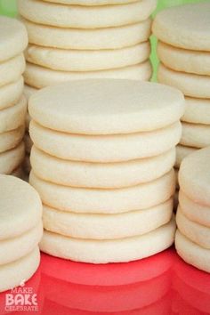 a pile of white cookies sitting on top of each other