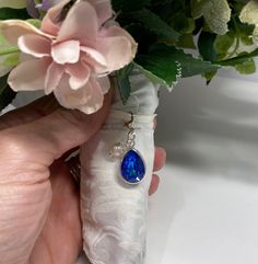 "This is a modern take on the traditional \"something blue\" to represent purity, love, and fidelity. A luxuriously sparkly, royal blue pear-shaped Swarovski crystal is featured in a rhodium-plated setting and hung from a silver-finished clasp. Perfect for any bride to wear on her wedding gown, in her bridal bouquet, or even on her wedding garter! Make this charm extra special by adding a beautiful, genuine cultured pearl--simply select that option when adding the charm to your cart. After the w Something Blue Crew Wedding, Something Blue Wedding Ideas, Something Blue Ideas, Some Old Something New Something Borrowed Something Blue, Something Old Something New Something Borrowed Something Blue, Something Blue Wedding Bouquet Charm, Something Blue Garter, Wedding Charm, Blue Charm