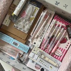 a box filled with lots of different types of pens