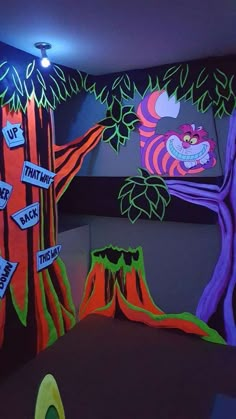 this is a play room for children with trees and signs on the walls that say it's halloween