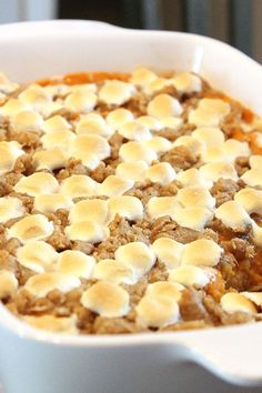 a casserole dish with marshmallows in it sitting on a table