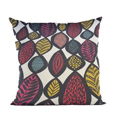 a pillow with colorful leaves on it