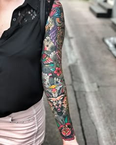 a woman with a tattoo on her arm