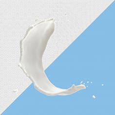 the milk is falling into the blue and white background