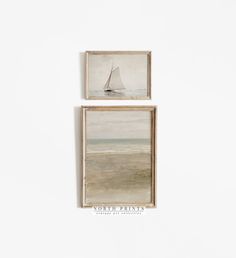 two framed paintings hang on the wall next to each other, one with a sailboat