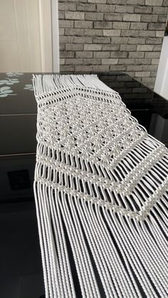 the table is made out of white yarn