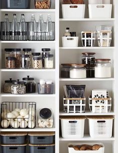 an organized pantry with white shelves and baskets