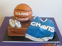 a cake made to look like a basketball and jersey