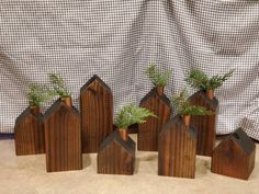 small wooden houses with trees in them