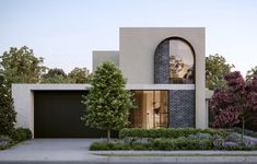 a modern house with an arched window in the front