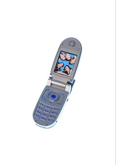 an open cell phone with pictures on the screen