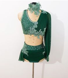 a woman's green belly dance costume on display