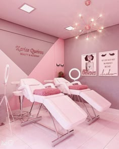 the interior of a beauty salon with pink walls and white reclining chairs in front of it