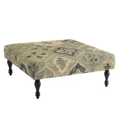 a footstool with an ornate pattern on it's legs and wooden feet