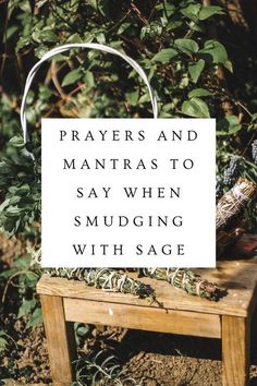 a sign that says prayer and mantras to say when smudging with sage