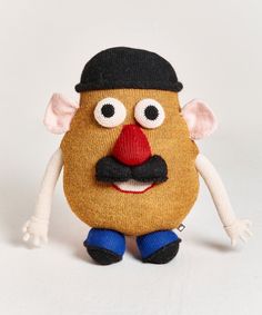 a stuffed toy with a hat and mustache