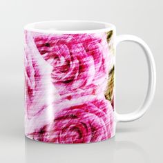 a coffee mug with pink roses on it