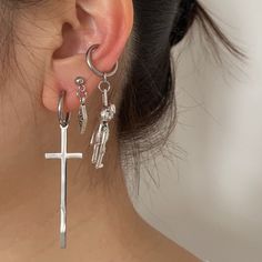 Add a touch of urban flair to your accessory collection with these hip hop bunny and cross clip on earrings in stainless steel! These unique and edgy earrings feature a playful bunny silhouette with a cool hip hop twist, alongside a stylish cross design. Made from durable stainless steel, these earrings are perfect for adding a bold statement to your look without the need for pierced ears. Stand out from the crowd and rock these trendy clip-on earrings with confidence! ▪️▪️▪️PRODUCT Sold by Pair Cheap Punk Hoop Earrings, Cheap Pierced Cross Jewelry, Cheap Punk Cross Jewelry, Cheap Punk Pierced Cartilage Earrings, Earrings For Emo, Affordable Metal Earrings For Streetwear, Bapesta Earrings, Cheap Punk Style Earrings For Gift, Affordable Punk Style Earrings For Gifts