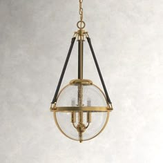 an antique brass chandelier hanging from the ceiling