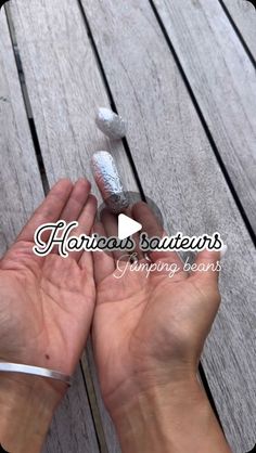 two hands are holding candy canes on a wooden deck with the words harros boutiquens