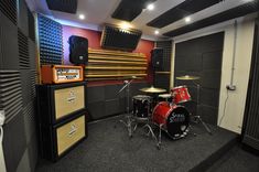 a recording studio with sound equipment and lights