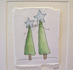 two green trees with stars on them