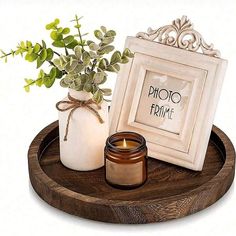 a wooden tray holding a candle and some flowers