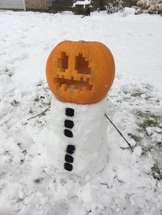 a pumpkin shaped like a snowman in the snow