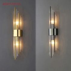 two wall lights that are next to each other on the wall, one is gold and the other is silver