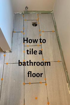 a bathroom floor with the words how to tile a bathroom floor in black and white