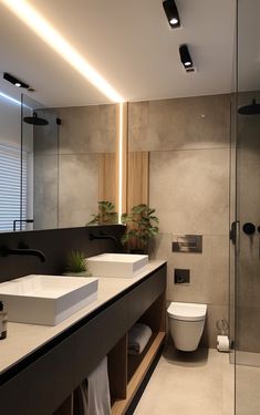 a modern bathroom with two sinks and a toilet in the middle, surrounded by plants