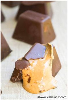 some pieces of chocolate and peanut butter on a table