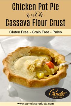 chicken pot pie with cassava flour crust in a white bowl on a marble table