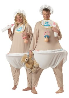 two people dressed in matching costumes holding baby items and a teddy bear, both wearing diapers