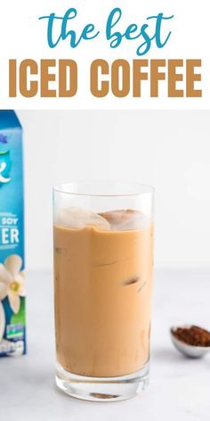 the best iced coffee is in a glass next to a carton of ice tea