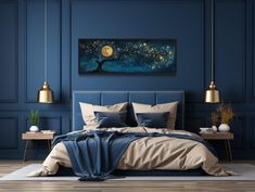 a bedroom with blue walls and wooden flooring has a large painting on the wall