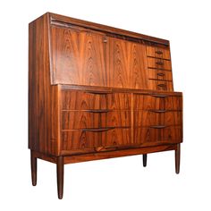 Origin: Denmark Designer: Erling Torvits Manufacturer: Klim Møbelfabrik Era: 1960s Materials: Rosewood Measurements: 49.25″ wide x 18.25″ deep x 48″ tall, Desk:34.75" wide x 28.75" deep x 29.25" tall Condition: In excellent original condition. Modern Rosewood Furniture, French Secretary Desk, Modern Secretary Desk, White Secretary Desk, Tall Desk, Wood Secretary Desk, Traditional Desk, Danish Mid Century Modern, Secretary Desk