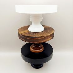 a table lamp with a wooden base and white glass shade on it's top