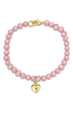 A single gilded heart charm dangles from this kid-size bracelet made from pretty pink freshwater pearls. Adult supervision strongly recommended; jewelry presents choking hazard and should be removed when infant or small child is unattended 5 1/2" length Lobster clasp closure Freshwater pearl/goldtone plate Imported Cute Pink Pearl Charm Jewelry, Adjustable Pink Bracelets With Pearl Charm, Light Pink Jewelry, Adjustable Pink Pearl Bracelet With Charm, Pink Pearl Charm Bracelet, Playful Pink Heart-shaped Bracelets, Bday Gifts, Pearl Heart, Pink Jewelry