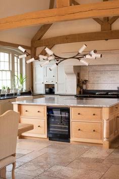 a large kitchen with an island in the middle