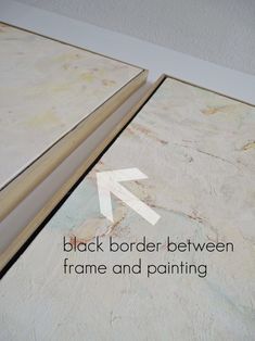 an open book with the words black border between frame and painting on it's cover