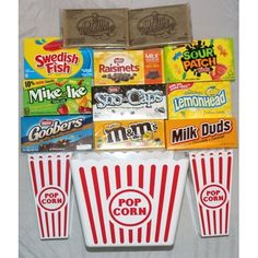 several different types of candy and snacks on a white sheet