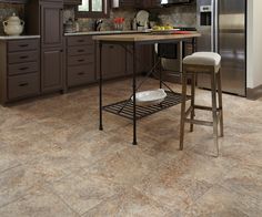 a kitchen with an island and stools in it