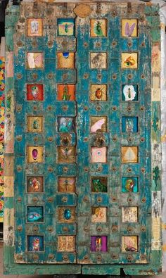 an old door with many pictures on it