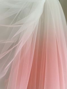 pink and white tulle skirt hanging on the wall