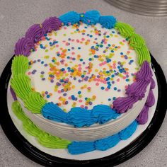 a birthday cake with sprinkles and frosting