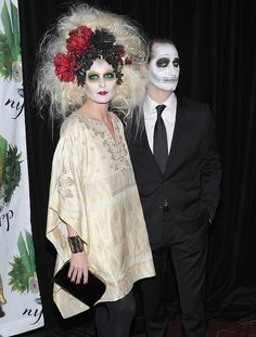 two people dressed up in costumes and makeup