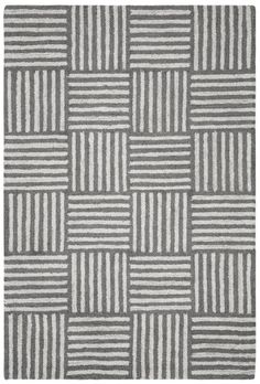 a gray and white rug with stripes on it