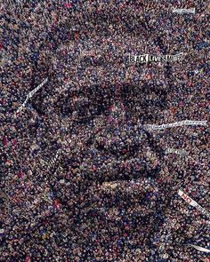 a large group of people gathered together in the shape of a man's face