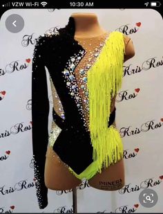 a female mannequin wearing a black and yellow leotard with sequins